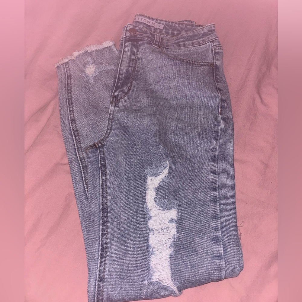 Light wash jeans slightly ripped